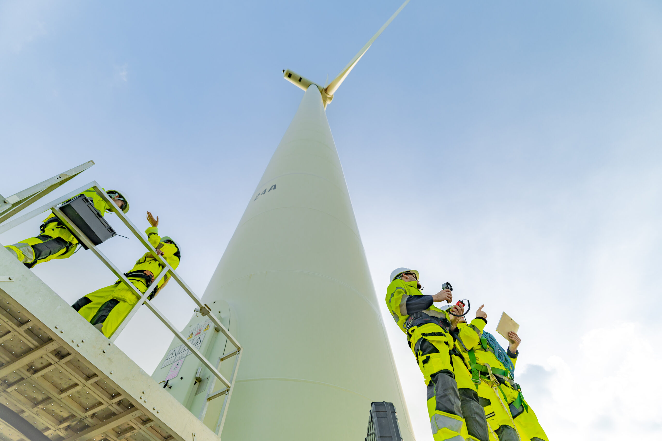 team of engineers a wind turbine power generation 2025 04 22 04 10 59 utc scaled